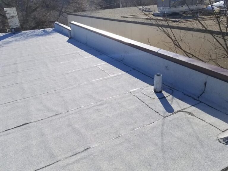 Membrane flat roof with a parapet edge, installed by Adept Construction