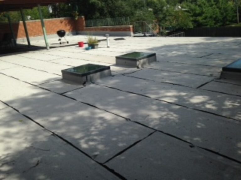 Flat roof with rooftop vents and curbs, installed by Adept Construction