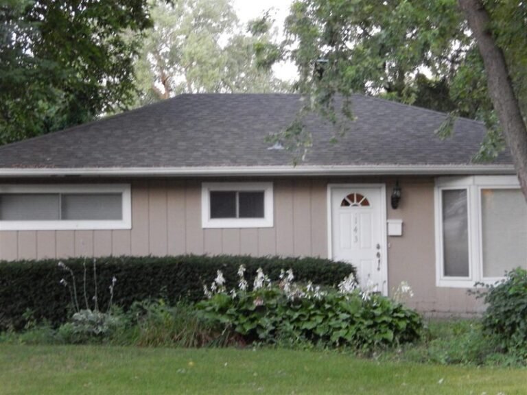 Roofing project by Adept Construction on a ranch home with a gray shingle roof