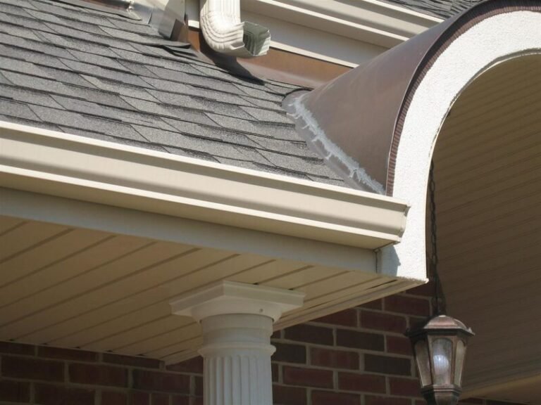 New soffit and siding trim under a roof edge, installed by Adept Construction