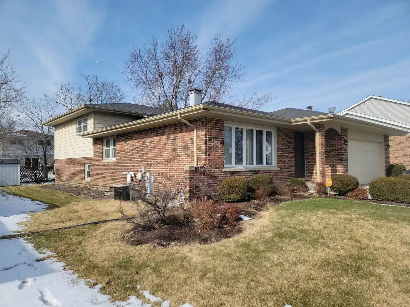 Brick split-level home in Downers Grove, IL with new soffit, fascia and gutters