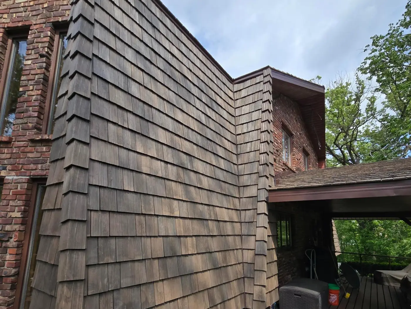 Close view of new synthetic cedar shakes at a corner in Homer Glen, IL