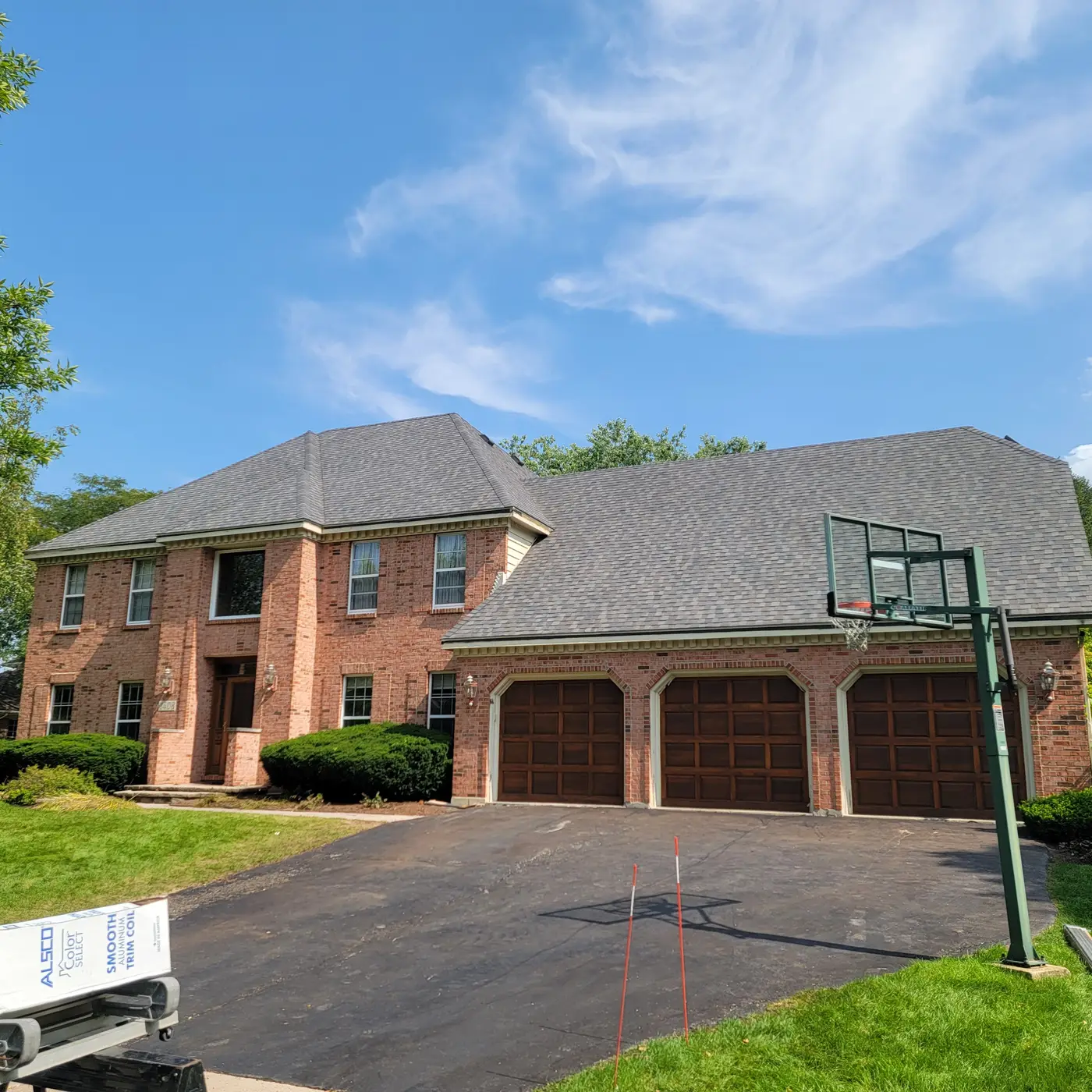 Architectural asphalt shingle roof on a brick home in Naperville, IL