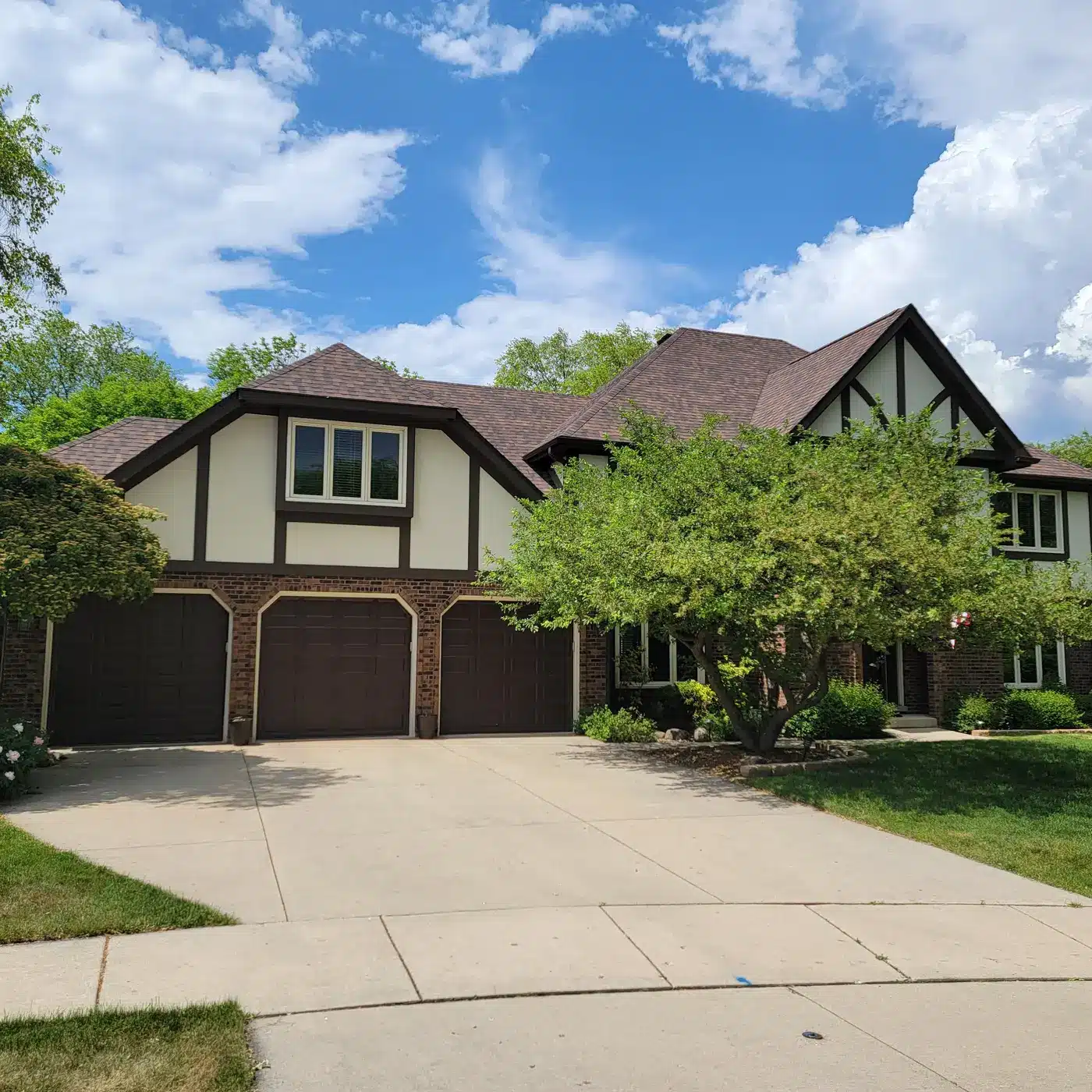 Burnt Sienna Roof and New Gutters on a Tudor in Naperville, IL