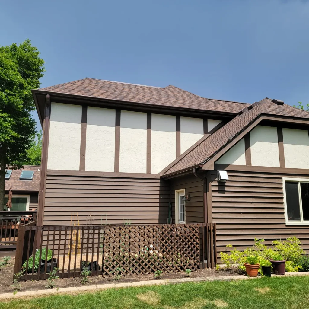 Side of a Naperville, IL home with a new Burnt Sienna roof and Royal Brown gutters