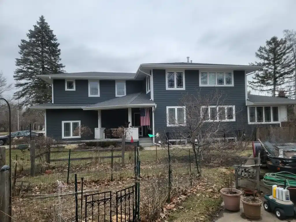 Two-story Villa Park, IL home with new charcoal siding and white trim