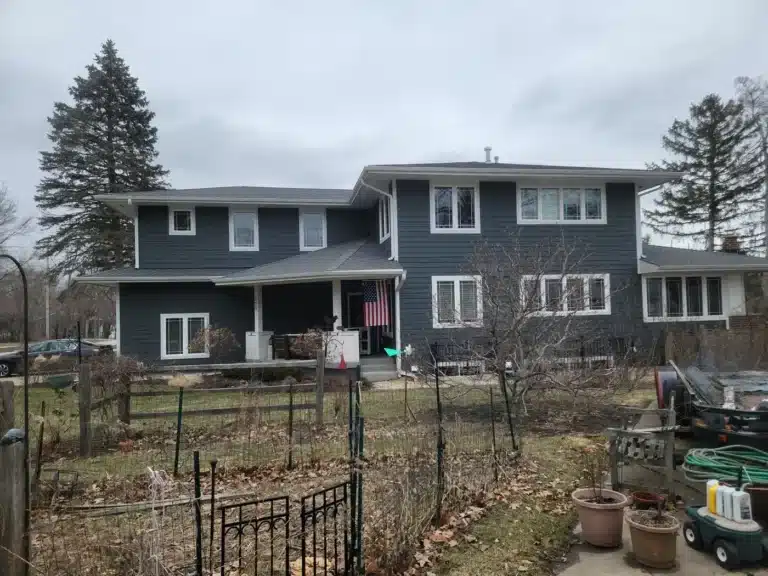 Two-story Villa Park, IL home with new charcoal siding and white trim