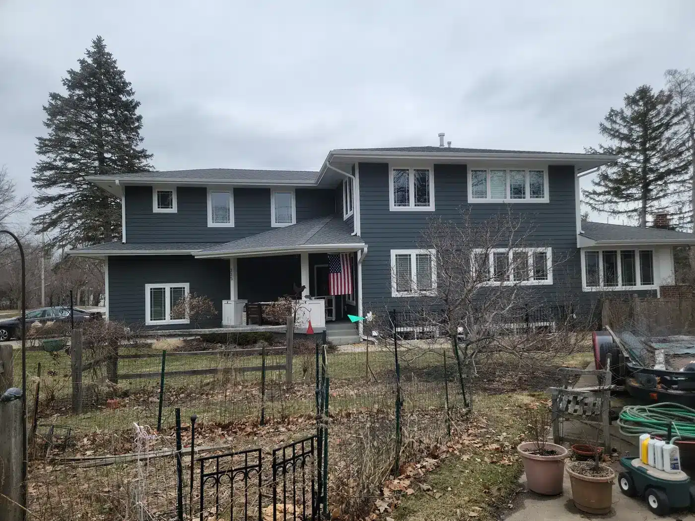Two-story Villa Park, IL home with new charcoal siding and white trim